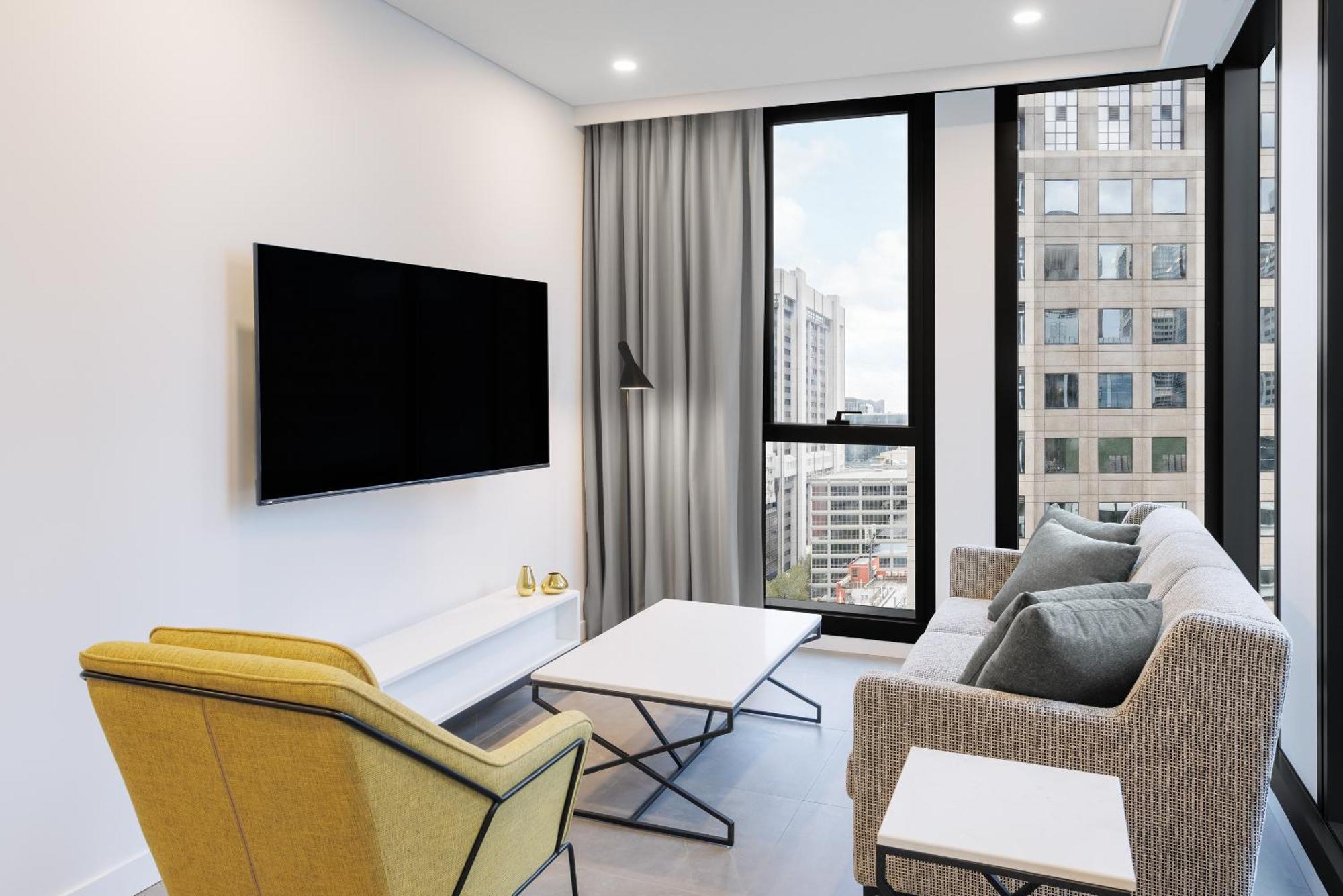 Meriton Suites Melbourne Eksteriør billede A living room